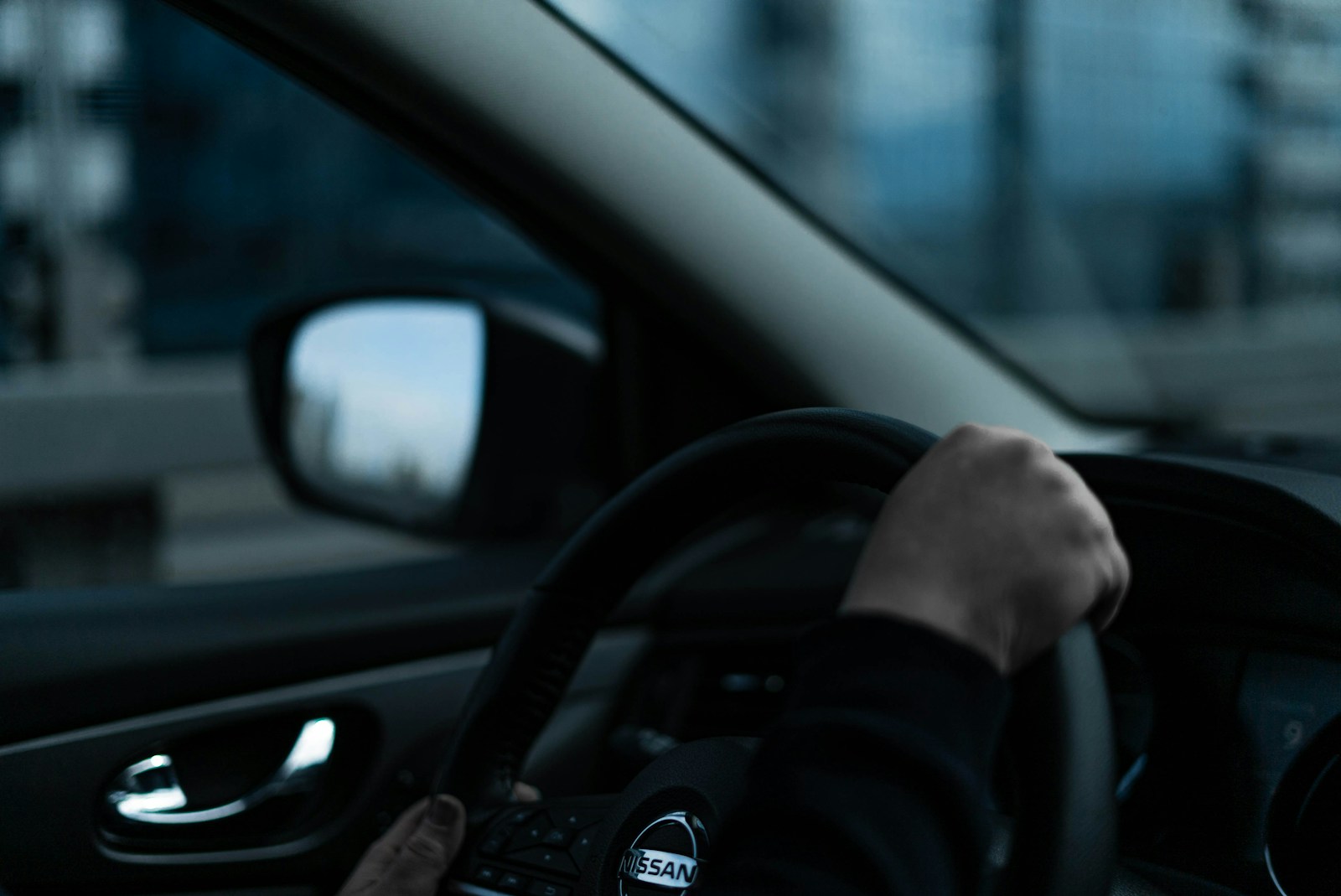 a person driving a car in the city